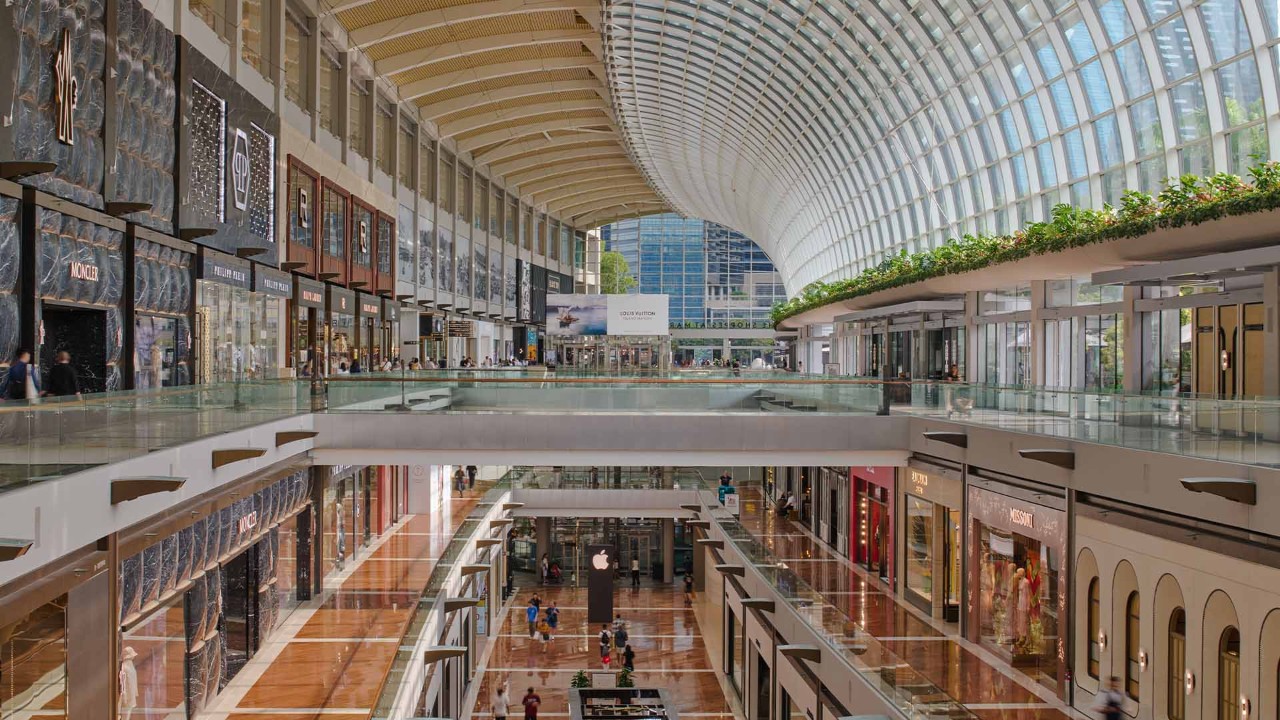 Couple walking past Gucci at The Shoppes, Marina Bay Sands