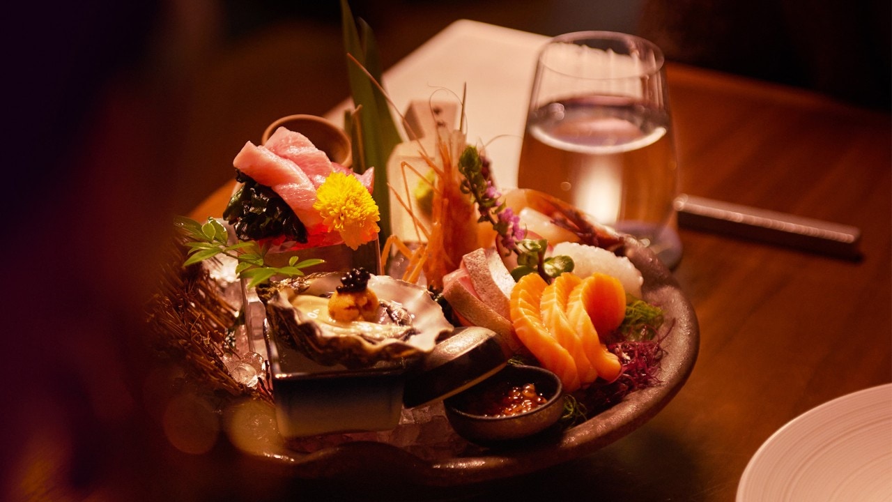 Assorted sashimi platter and sides with tofu and egg at Wakuda