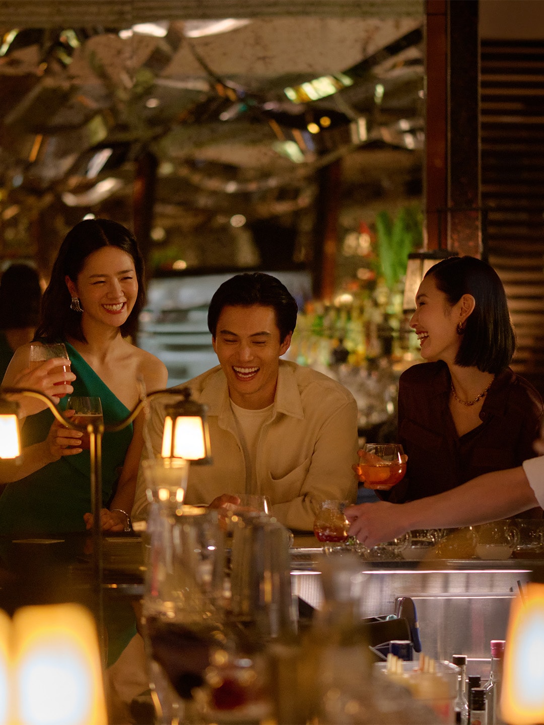 Friends walking down the Helix Bridge to Marina Bay Sands